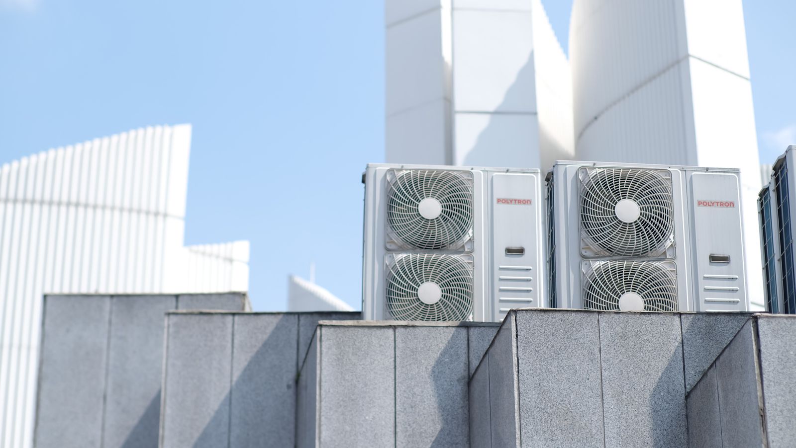 Rooftop commercial HVAC condenser units on a building