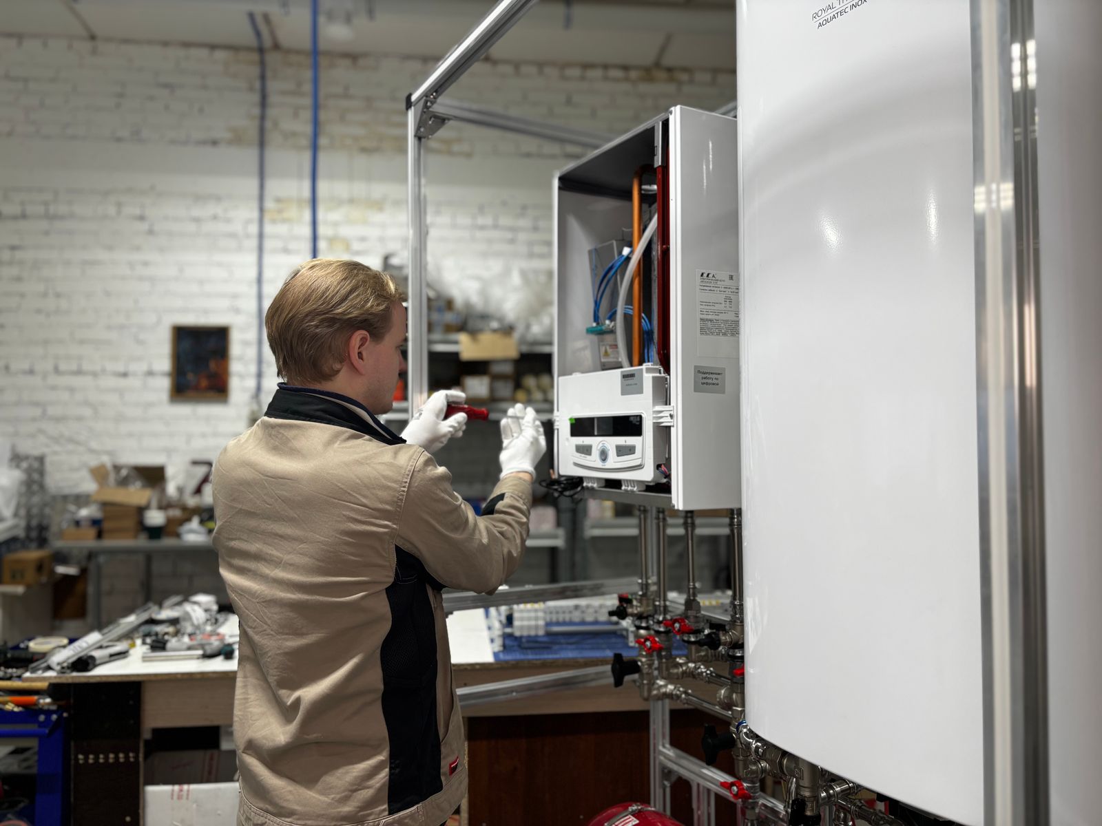 Technician servicing a home furnace heating system