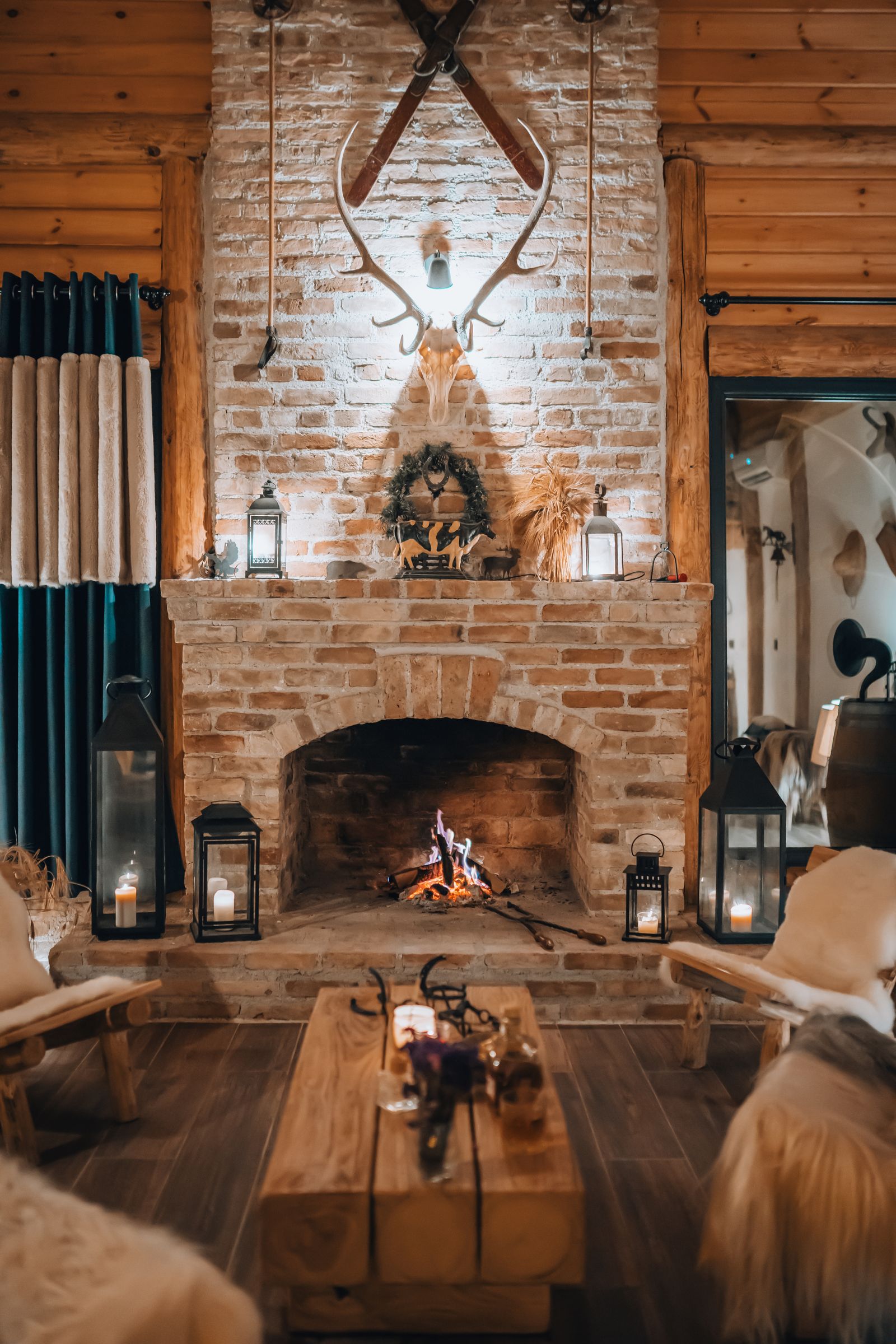 Warm brick fireplace glowing in a cozy winter living room