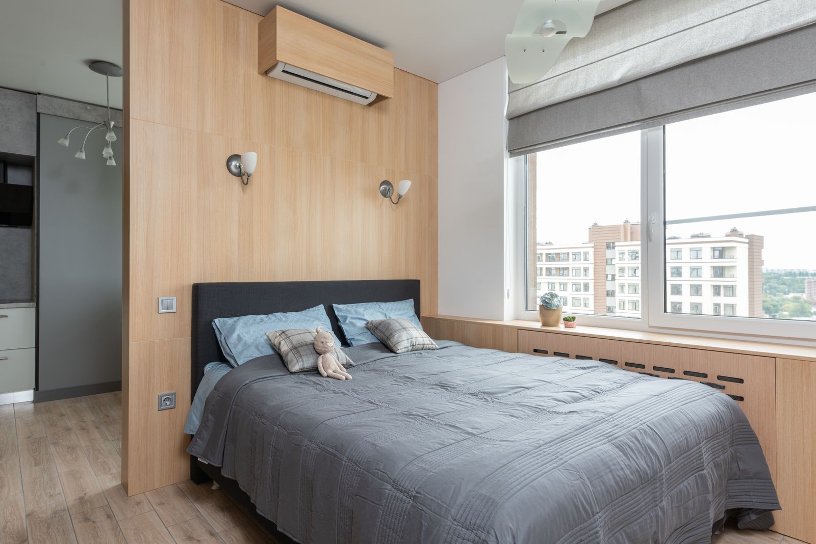 Wall-mounted ductless mini-split air conditioner in a bedroom